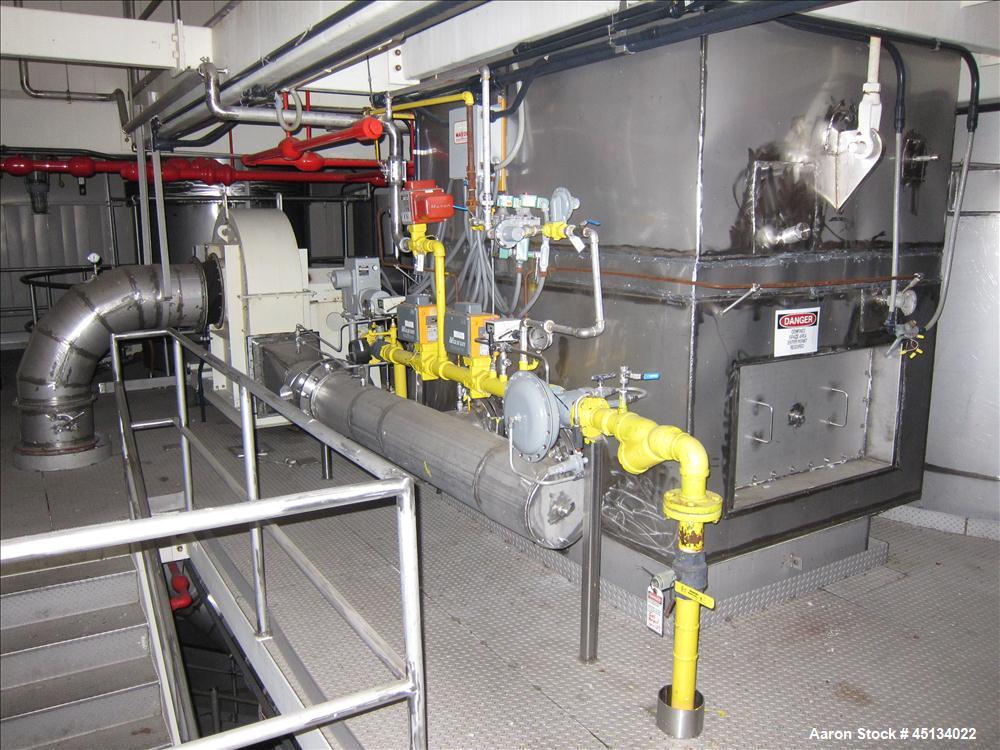 Used Niro Spray Tower Dryer. Originally designed for 12,500 pounds / hour of water evaporation. The dryer capacity was increased to 15,000 pounds / hour at 65,000 SCFM of air flow.  The Dryer is constructed of 316 L Stainless Steel. The dryer is a Standard Tall Form Dryer equipped with an integral static Fluid Bed Dryer and external Vibratory Fluid Bed Cooler. Both beds have heaters and the VFB also had a Cooler. The Dryer was equipped with fines return and agglomeration capabilities as an opti
