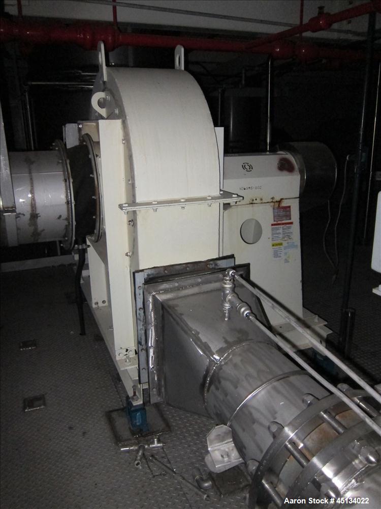 Used Niro Spray Tower Dryer. Originally designed for 12,500 pounds / hour of water evaporation. The dryer capacity was increased to 15,000 pounds / hour at 65,000 SCFM of air flow.  The Dryer is constructed of 316 L Stainless Steel. The dryer is a Standard Tall Form Dryer equipped with an integral static Fluid Bed Dryer and external Vibratory Fluid Bed Cooler. Both beds have heaters and the VFB also had a Cooler. The Dryer was equipped with fines return and agglomeration capabilities as an opti