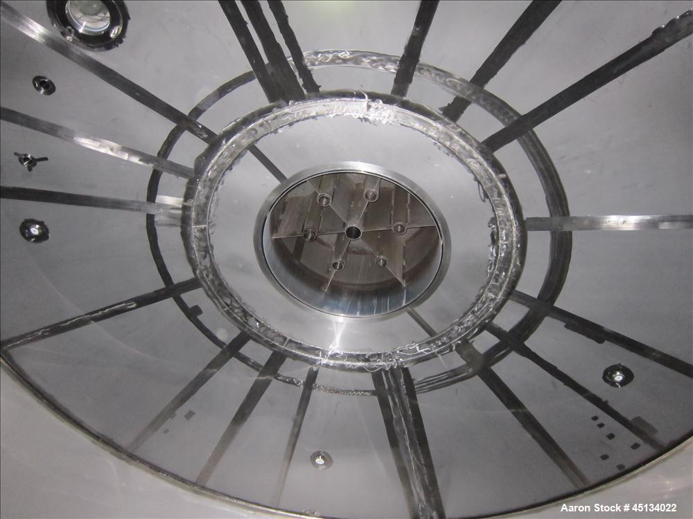 Used Niro Spray Tower Dryer. Originally designed for 12,500 pounds / hour of water evaporation. The dryer capacity was increased to 15,000 pounds / hour at 65,000 SCFM of air flow.  The Dryer is constructed of 316 L Stainless Steel. The dryer is a Standard Tall Form Dryer equipped with an integral static Fluid Bed Dryer and external Vibratory Fluid Bed Cooler. Both beds have heaters and the VFB also had a Cooler. The Dryer was equipped with fines return and agglomeration capabilities as an opti