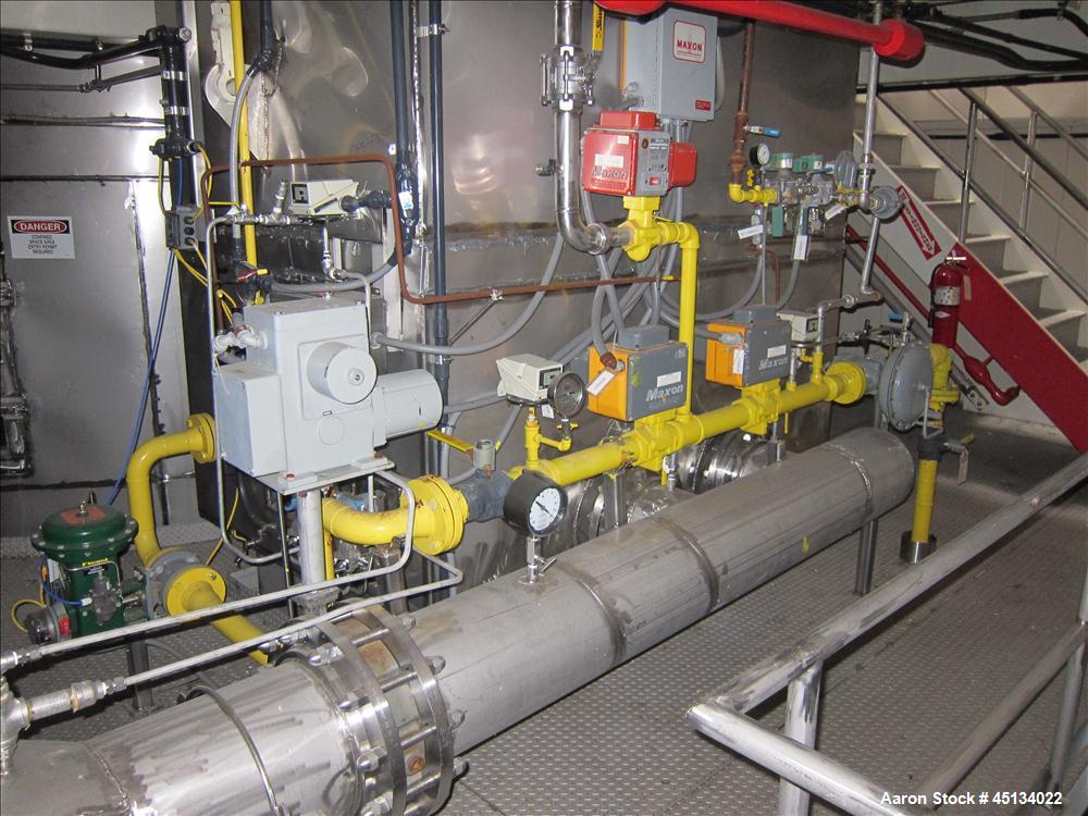 Used Niro Spray Tower Dryer. Originally designed for 12,500 pounds / hour of water evaporation. The dryer capacity was increased to 15,000 pounds / hour at 65,000 SCFM of air flow.  The Dryer is constructed of 316 L Stainless Steel. The dryer is a Standard Tall Form Dryer equipped with an integral static Fluid Bed Dryer and external Vibratory Fluid Bed Cooler. Both beds have heaters and the VFB also had a Cooler. The Dryer was equipped with fines return and agglomeration capabilities as an opti