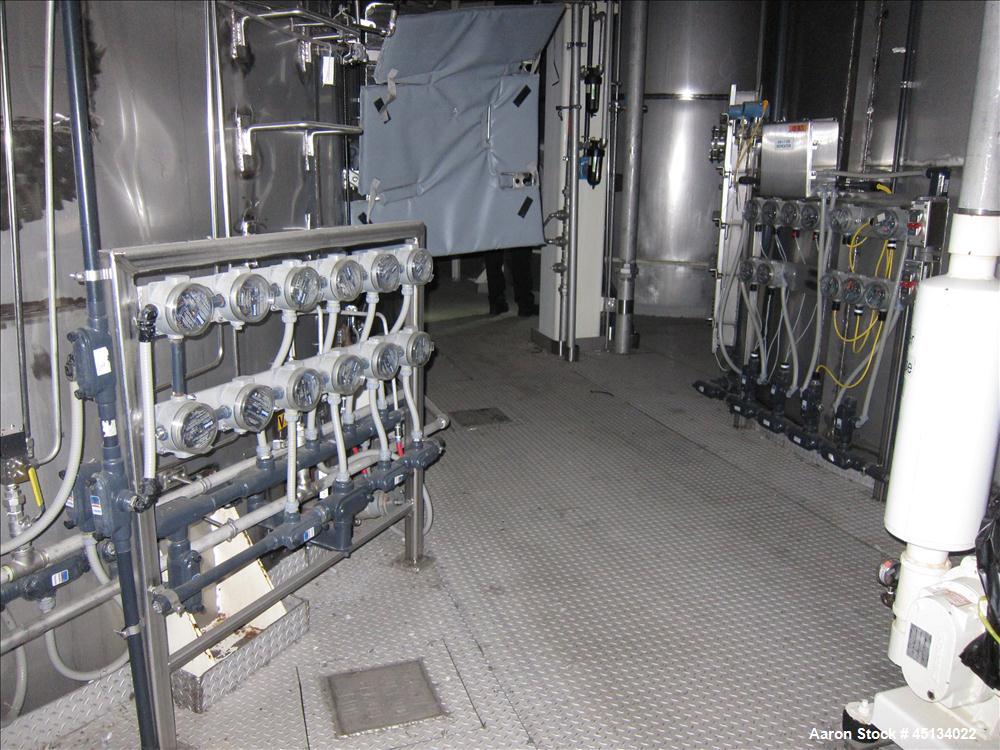 Used Niro Spray Tower Dryer. Originally designed for 12,500 pounds / hour of water evaporation. The dryer capacity was increased to 15,000 pounds / hour at 65,000 SCFM of air flow.  The Dryer is constructed of 316 L Stainless Steel. The dryer is a Standard Tall Form Dryer equipped with an integral static Fluid Bed Dryer and external Vibratory Fluid Bed Cooler. Both beds have heaters and the VFB also had a Cooler. The Dryer was equipped with fines return and agglomeration capabilities as an opti