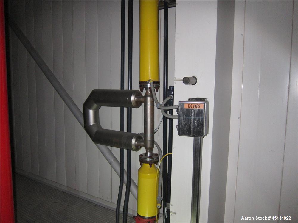Used Niro Spray Tower Dryer. Originally designed for 12,500 pounds / hour of water evaporation. The dryer capacity was increased to 15,000 pounds / hour at 65,000 SCFM of air flow.  The Dryer is constructed of 316 L Stainless Steel. The dryer is a Standard Tall Form Dryer equipped with an integral static Fluid Bed Dryer and external Vibratory Fluid Bed Cooler. Both beds have heaters and the VFB also had a Cooler. The Dryer was equipped with fines return and agglomeration capabilities as an opti