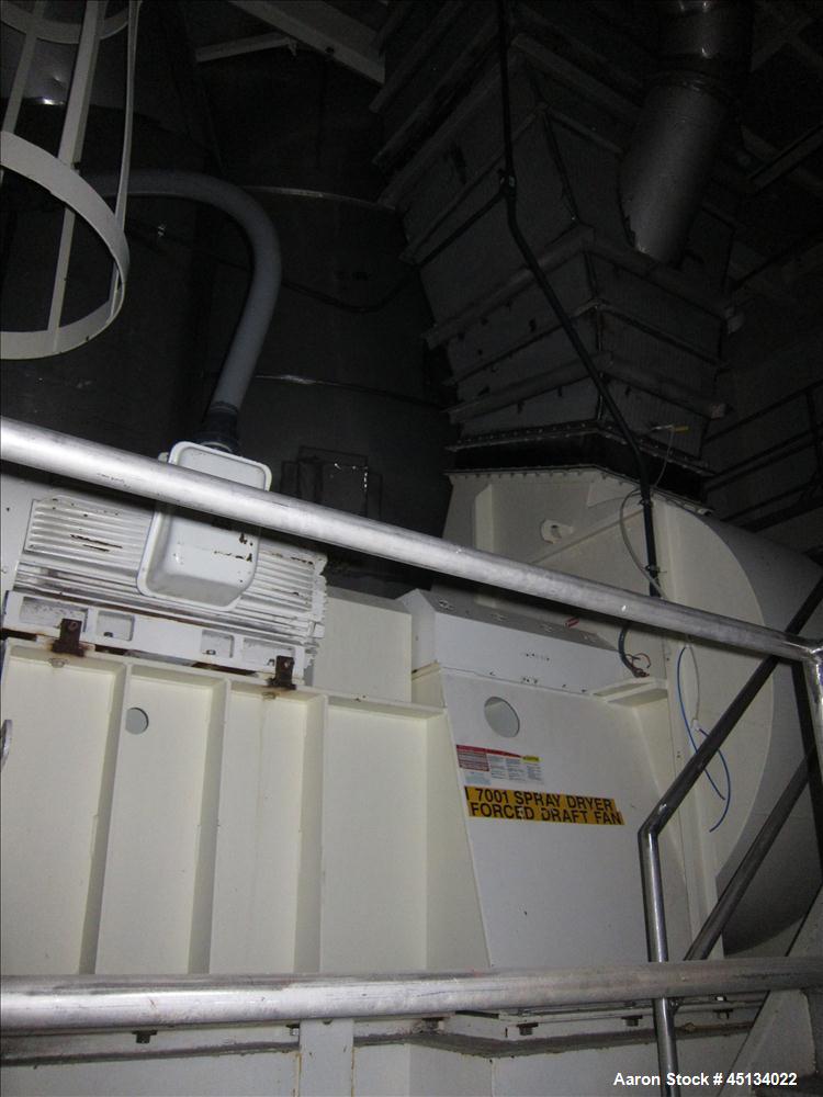 Used Niro Spray Tower Dryer. Originally designed for 12,500 pounds / hour of water evaporation. The dryer capacity was increased to 15,000 pounds / hour at 65,000 SCFM of air flow.  The Dryer is constructed of 316 L Stainless Steel. The dryer is a Standard Tall Form Dryer equipped with an integral static Fluid Bed Dryer and external Vibratory Fluid Bed Cooler. Both beds have heaters and the VFB also had a Cooler. The Dryer was equipped with fines return and agglomeration capabilities as an opti