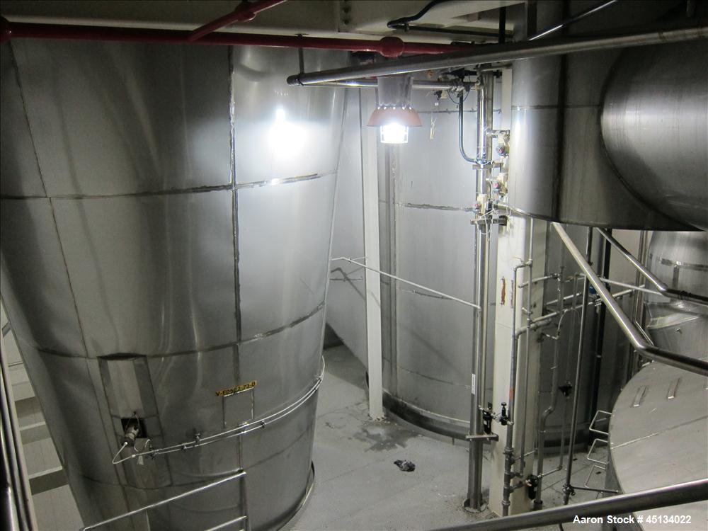 Used Niro Spray Tower Dryer. Originally designed for 12,500 pounds / hour of water evaporation. The dryer capacity was increased to 15,000 pounds / hour at 65,000 SCFM of air flow.  The Dryer is constructed of 316 L Stainless Steel. The dryer is a Standard Tall Form Dryer equipped with an integral static Fluid Bed Dryer and external Vibratory Fluid Bed Cooler. Both beds have heaters and the VFB also had a Cooler. The Dryer was equipped with fines return and agglomeration capabilities as an opti