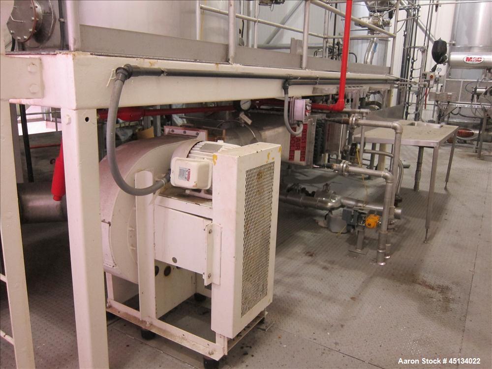 Used Niro Spray Tower Dryer. Originally designed for 12,500 pounds / hour of water evaporation. The dryer capacity was increased to 15,000 pounds / hour at 65,000 SCFM of air flow.  The Dryer is constructed of 316 L Stainless Steel. The dryer is a Standard Tall Form Dryer equipped with an integral static Fluid Bed Dryer and external Vibratory Fluid Bed Cooler. Both beds have heaters and the VFB also had a Cooler. The Dryer was equipped with fines return and agglomeration capabilities as an opti