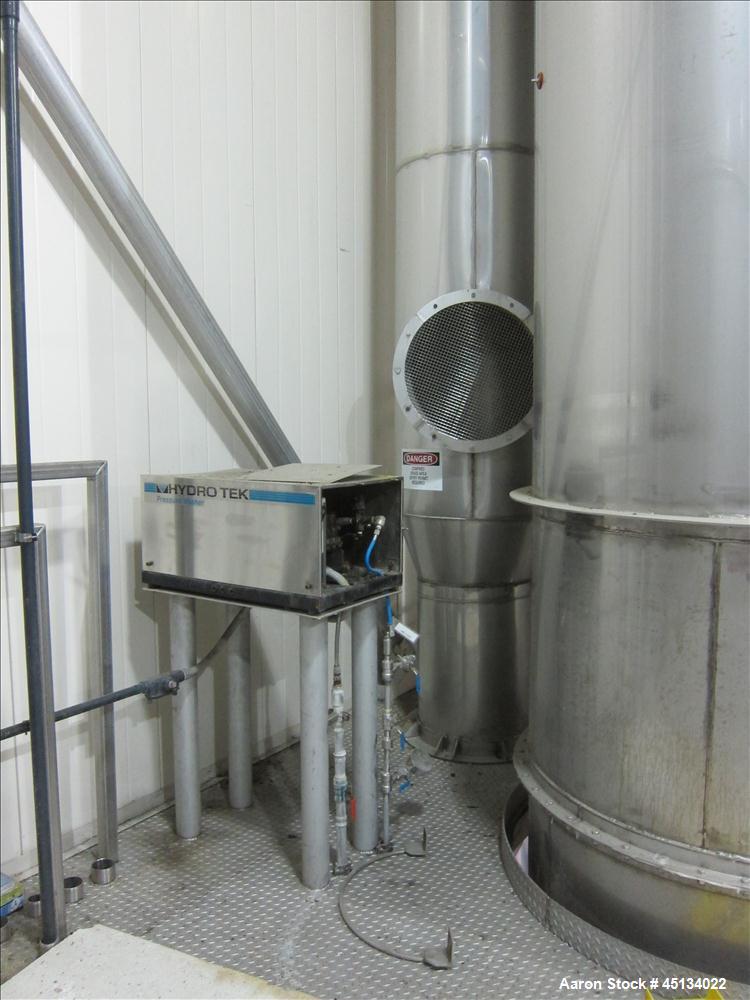 Used Niro Spray Tower Dryer. Originally designed for 12,500 pounds / hour of water evaporation. The dryer capacity was increased to 15,000 pounds / hour at 65,000 SCFM of air flow.  The Dryer is constructed of 316 L Stainless Steel. The dryer is a Standard Tall Form Dryer equipped with an integral static Fluid Bed Dryer and external Vibratory Fluid Bed Cooler. Both beds have heaters and the VFB also had a Cooler. The Dryer was equipped with fines return and agglomeration capabilities as an opti