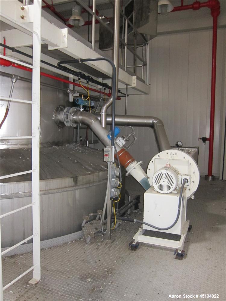 Used Niro Spray Tower Dryer. Originally designed for 12,500 pounds / hour of water evaporation. The dryer capacity was increased to 15,000 pounds / hour at 65,000 SCFM of air flow.  The Dryer is constructed of 316 L Stainless Steel. The dryer is a Standard Tall Form Dryer equipped with an integral static Fluid Bed Dryer and external Vibratory Fluid Bed Cooler. Both beds have heaters and the VFB also had a Cooler. The Dryer was equipped with fines return and agglomeration capabilities as an opti