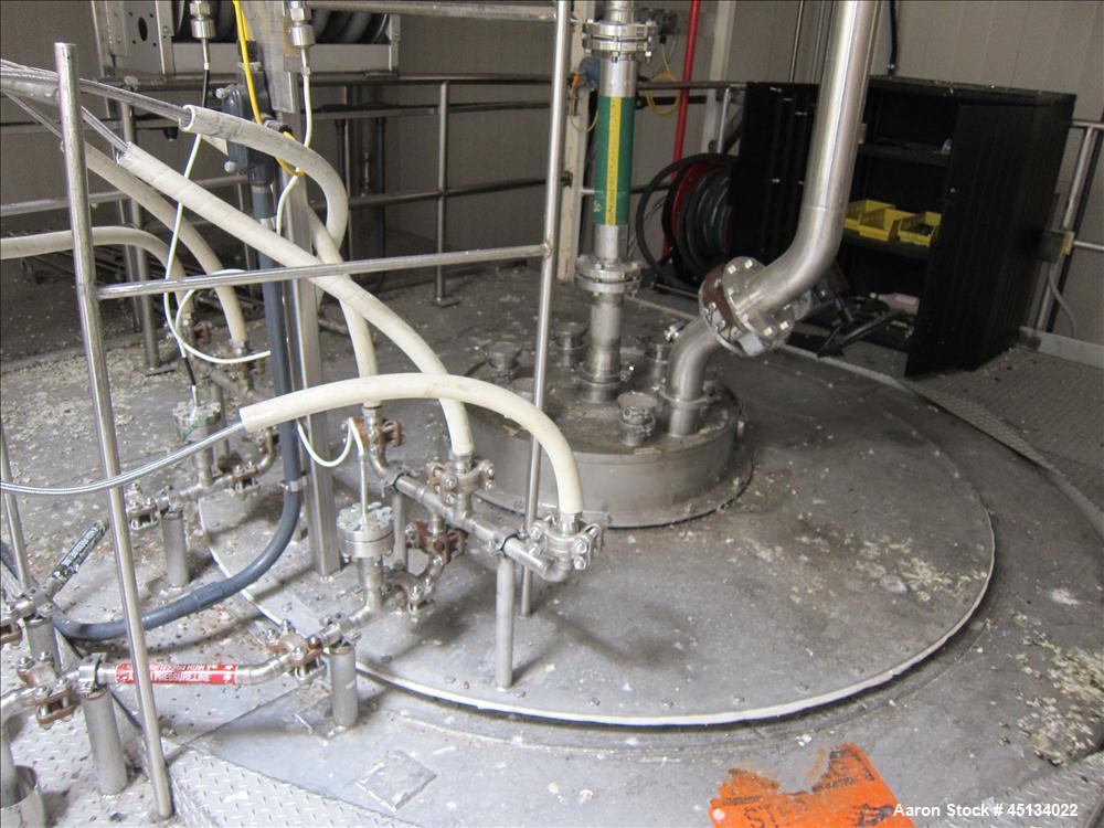 Used Niro Spray Tower Dryer. Originally designed for 12,500 pounds / hour of water evaporation. The dryer capacity was increased to 15,000 pounds / hour at 65,000 SCFM of air flow.  The Dryer is constructed of 316 L Stainless Steel. The dryer is a Standard Tall Form Dryer equipped with an integral static Fluid Bed Dryer and external Vibratory Fluid Bed Cooler. Both beds have heaters and the VFB also had a Cooler. The Dryer was equipped with fines return and agglomeration capabilities as an opti
