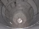Used Niro Spray Tower Dryer. Originally designed for 12,500 pounds / hour of water evaporation. The dryer capacity was increased to 15,000 pounds / hour at 65,000 SCFM of air flow.  The Dryer is constructed of 316 L Stainless Steel. The dryer is a Standard Tall Form Dryer equipped with an integral static Fluid Bed Dryer and external Vibratory Fluid Bed Cooler. Both beds have heaters and the VFB also had a Cooler. The Dryer was equipped with fines return and agglomeration capabilities as an opti