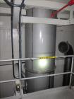 Used Niro Spray Tower Dryer. Originally designed for 12,500 pounds / hour of water evaporation. The dryer capacity was increased to 15,000 pounds / hour at 65,000 SCFM of air flow.  The Dryer is constructed of 316 L Stainless Steel. The dryer is a Standard Tall Form Dryer equipped with an integral static Fluid Bed Dryer and external Vibratory Fluid Bed Cooler. Both beds have heaters and the VFB also had a Cooler. The Dryer was equipped with fines return and agglomeration capabilities as an opti