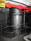 Used Niro Spray Tower Dryer. Originally designed for 12,500 pounds / hour of water evaporation. The dryer capacity was increased to 15,000 pounds / hour at 65,000 SCFM of air flow.  The Dryer is constructed of 316 L Stainless Steel. The dryer is a Standard Tall Form Dryer equipped with an integral static Fluid Bed Dryer and external Vibratory Fluid Bed Cooler. Both beds have heaters and the VFB also had a Cooler. The Dryer was equipped with fines return and agglomeration capabilities as an opti