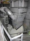 Used Niro Spray Tower Dryer. Originally designed for 12,500 pounds / hour of water evaporation. The dryer capacity was increased to 15,000 pounds / hour at 65,000 SCFM of air flow.  The Dryer is constructed of 316 L Stainless Steel. The dryer is a Standard Tall Form Dryer equipped with an integral static Fluid Bed Dryer and external Vibratory Fluid Bed Cooler. Both beds have heaters and the VFB also had a Cooler. The Dryer was equipped with fines return and agglomeration capabilities as an opti
