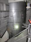 Used Niro Spray Tower Dryer. Originally designed for 12,500 pounds / hour of water evaporation. The dryer capacity was increased to 15,000 pounds / hour at 65,000 SCFM of air flow.  The Dryer is constructed of 316 L Stainless Steel. The dryer is a Standard Tall Form Dryer equipped with an integral static Fluid Bed Dryer and external Vibratory Fluid Bed Cooler. Both beds have heaters and the VFB also had a Cooler. The Dryer was equipped with fines return and agglomeration capabilities as an opti