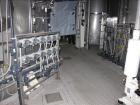 Used Niro Spray Tower Dryer. Originally designed for 12,500 pounds / hour of water evaporation. The dryer capacity was increased to 15,000 pounds / hour at 65,000 SCFM of air flow.  The Dryer is constructed of 316 L Stainless Steel. The dryer is a Standard Tall Form Dryer equipped with an integral static Fluid Bed Dryer and external Vibratory Fluid Bed Cooler. Both beds have heaters and the VFB also had a Cooler. The Dryer was equipped with fines return and agglomeration capabilities as an opti