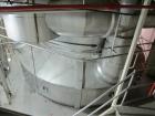 Used Niro Spray Tower Dryer. Originally designed for 12,500 pounds / hour of water evaporation. The dryer capacity was increased to 15,000 pounds / hour at 65,000 SCFM of air flow.  The Dryer is constructed of 316 L Stainless Steel. The dryer is a Standard Tall Form Dryer equipped with an integral static Fluid Bed Dryer and external Vibratory Fluid Bed Cooler. Both beds have heaters and the VFB also had a Cooler. The Dryer was equipped with fines return and agglomeration capabilities as an opti