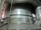 Used Niro Spray Tower Dryer. Originally designed for 12,500 pounds / hour of water evaporation. The dryer capacity was increased to 15,000 pounds / hour at 65,000 SCFM of air flow.  The Dryer is constructed of 316 L Stainless Steel. The dryer is a Standard Tall Form Dryer equipped with an integral static Fluid Bed Dryer and external Vibratory Fluid Bed Cooler. Both beds have heaters and the VFB also had a Cooler. The Dryer was equipped with fines return and agglomeration capabilities as an opti