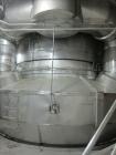 Used Niro Spray Tower Dryer. Originally designed for 12,500 pounds / hour of water evaporation. The dryer capacity was increased to 15,000 pounds / hour at 65,000 SCFM of air flow.  The Dryer is constructed of 316 L Stainless Steel. The dryer is a Standard Tall Form Dryer equipped with an integral static Fluid Bed Dryer and external Vibratory Fluid Bed Cooler. Both beds have heaters and the VFB also had a Cooler. The Dryer was equipped with fines return and agglomeration capabilities as an opti