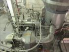 Used Niro Spray Tower Dryer. Originally designed for 12,500 pounds / hour of water evaporation. The dryer capacity was increased to 15,000 pounds / hour at 65,000 SCFM of air flow.  The Dryer is constructed of 316 L Stainless Steel. The dryer is a Standard Tall Form Dryer equipped with an integral static Fluid Bed Dryer and external Vibratory Fluid Bed Cooler. Both beds have heaters and the VFB also had a Cooler. The Dryer was equipped with fines return and agglomeration capabilities as an opti