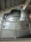 Used Niro Spray Tower Dryer. Originally designed for 12,500 pounds / hour of water evaporation. The dryer capacity was increased to 15,000 pounds / hour at 65,000 SCFM of air flow.  The Dryer is constructed of 316 L Stainless Steel. The dryer is a Standard Tall Form Dryer equipped with an integral static Fluid Bed Dryer and external Vibratory Fluid Bed Cooler. Both beds have heaters and the VFB also had a Cooler. The Dryer was equipped with fines return and agglomeration capabilities as an opti