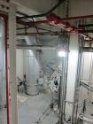 Used Niro Spray Tower Dryer. Originally designed for 12,500 pounds / hour of water evaporation. The dryer capacity was increased to 15,000 pounds / hour at 65,000 SCFM of air flow.  The Dryer is constructed of 316 L Stainless Steel. The dryer is a Standard Tall Form Dryer equipped with an integral static Fluid Bed Dryer and external Vibratory Fluid Bed Cooler. Both beds have heaters and the VFB also had a Cooler. The Dryer was equipped with fines return and agglomeration capabilities as an opti