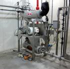 Used Niro Spray Tower Dryer. Originally designed for 12,500 pounds / hour of water evaporation. The dryer capacity was increased to 15,000 pounds / hour at 65,000 SCFM of air flow.  The Dryer is constructed of 316 L Stainless Steel. The dryer is a Standard Tall Form Dryer equipped with an integral static Fluid Bed Dryer and external Vibratory Fluid Bed Cooler. Both beds have heaters and the VFB also had a Cooler. The Dryer was equipped with fines return and agglomeration capabilities as an opti