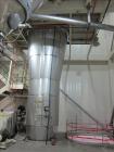 Used Niro Spray Tower Dryer. Originally designed for 12,500 pounds / hour of water evaporation. The dryer capacity was increased to 15,000 pounds / hour at 65,000 SCFM of air flow.  The Dryer is constructed of 316 L Stainless Steel. The dryer is a Standard Tall Form Dryer equipped with an integral static Fluid Bed Dryer and external Vibratory Fluid Bed Cooler. Both beds have heaters and the VFB also had a Cooler. The Dryer was equipped with fines return and agglomeration capabilities as an opti