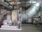 Used Niro Spray Tower Dryer. Originally designed for 12,500 pounds / hour of water evaporation. The dryer capacity was increased to 15,000 pounds / hour at 65,000 SCFM of air flow.  The Dryer is constructed of 316 L Stainless Steel. The dryer is a Standard Tall Form Dryer equipped with an integral static Fluid Bed Dryer and external Vibratory Fluid Bed Cooler. Both beds have heaters and the VFB also had a Cooler. The Dryer was equipped with fines return and agglomeration capabilities as an opti