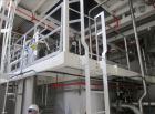 Used Niro Spray Tower Dryer. Originally designed for 12,500 pounds / hour of water evaporation. The dryer capacity was increased to 15,000 pounds / hour at 65,000 SCFM of air flow.  The Dryer is constructed of 316 L Stainless Steel. The dryer is a Standard Tall Form Dryer equipped with an integral static Fluid Bed Dryer and external Vibratory Fluid Bed Cooler. Both beds have heaters and the VFB also had a Cooler. The Dryer was equipped with fines return and agglomeration capabilities as an opti