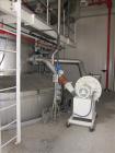 Used Niro Spray Tower Dryer. Originally designed for 12,500 pounds / hour of water evaporation. The dryer capacity was increased to 15,000 pounds / hour at 65,000 SCFM of air flow.  The Dryer is constructed of 316 L Stainless Steel. The dryer is a Standard Tall Form Dryer equipped with an integral static Fluid Bed Dryer and external Vibratory Fluid Bed Cooler. Both beds have heaters and the VFB also had a Cooler. The Dryer was equipped with fines return and agglomeration capabilities as an opti