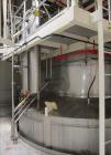 Used Niro Spray Tower Dryer. Originally designed for 12,500 pounds / hour of water evaporation. The dryer capacity was increased to 15,000 pounds / hour at 65,000 SCFM of air flow.  The Dryer is constructed of 316 L Stainless Steel. The dryer is a Standard Tall Form Dryer equipped with an integral static Fluid Bed Dryer and external Vibratory Fluid Bed Cooler. Both beds have heaters and the VFB also had a Cooler. The Dryer was equipped with fines return and agglomeration capabilities as an opti