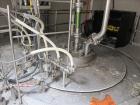 Used Niro Spray Tower Dryer. Originally designed for 12,500 pounds / hour of water evaporation. The dryer capacity was increased to 15,000 pounds / hour at 65,000 SCFM of air flow.  The Dryer is constructed of 316 L Stainless Steel. The dryer is a Standard Tall Form Dryer equipped with an integral static Fluid Bed Dryer and external Vibratory Fluid Bed Cooler. Both beds have heaters and the VFB also had a Cooler. The Dryer was equipped with fines return and agglomeration capabilities as an opti