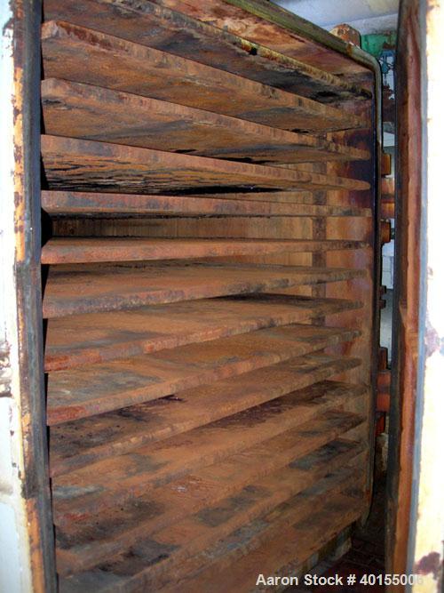 Used:  Devine vacuum shelf dryer, 451.70 square feet, carbon steel. (15) 58" wide x 78-3/4" deep x 1-1/4" thick jacketed shelves, 14 usable. 3-5/8" spacing between shelves. Approximate chamber 6' wid...