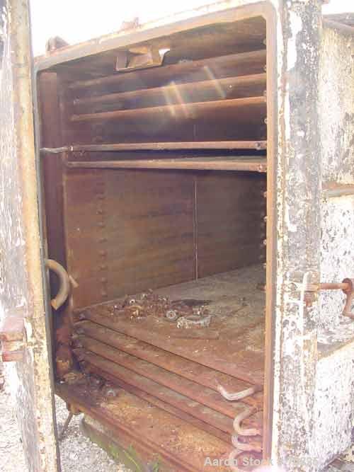 USED: Devine No 28 vacuum shelf dryer, 613 sq ft, cast iron body.Chamber 60" wide x 69" high x 84" deep, rated full vacuum. 10 shelves59" wide x 78-3/4" deep, rated approx 30 psi. 2-5/16" spacing bet...
