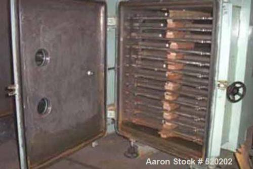 USED: 136 sq ft J P Devine stainless steel vacuum shelf dryer. (12) 39" x 42" 316 stainless steel shelves rated 30 psi, 3" shelf spacing, 316 stainless steel lined door and chamber, swing away door w...