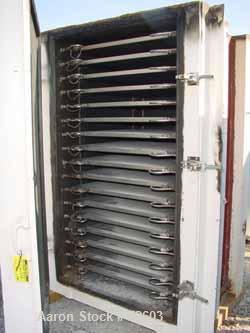 USED: Devine vacuum shelf dryer, approx 185 sq ft surface area, castaluminum. Unit has 17 heated shelves (16 usable) 42" wide x 42" deepon 3-1/2" spacing. Chamber is 43" wide x 77" tall x 48" deep. H...