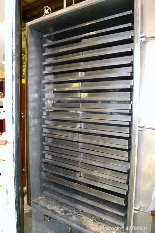 Used Hull Vacuum Shelf Dryer, Model 10GS20, Approximately 350 Square Feet. (19) 309 Stainless U stamped jacketed shelves 44" wide x 58-3/4" deep x 1" thick rated 50 psi at 300 deg.f.. 3-1/4" Spacing ...