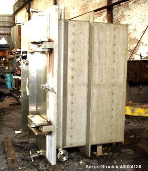 Used United McGill Vacuum Shelf Dryer. Model 11F.  Approximately 224.40 square feet. Chamber 60" wide x 69" tall x 47" deep. (15) 316 stainless steel shelves (14 usable) coated with "plasite" phenoli...