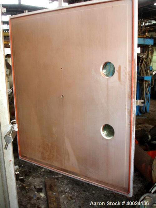Used United McGill Vacuum Shelf Dryer. Model 11F.  Approximately 224.40 square feet. Chamber 60" wide x 69" tall x 47" deep. (15) 316 stainless steel shelves (14 usable) coated with "plasite" phenoli...