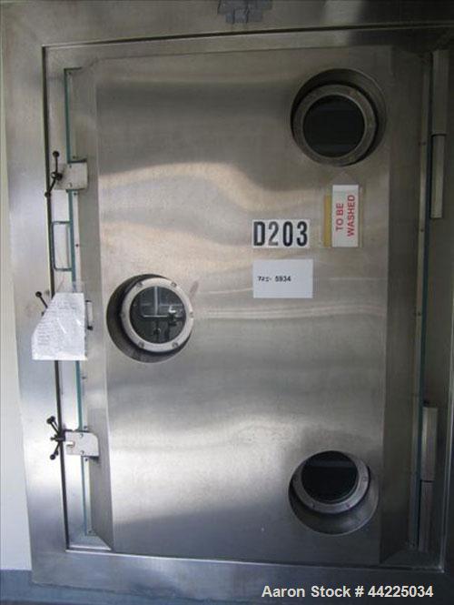 Used Stokes Vacuum Shelf Dryer, Model 900-338-205. Halar lined carbon steel. (10) 44" x 40" Shelves, 5.6" spacing, 95.2 cubic foot chamber, 122 sqaure foot shelf area. Chamber rated vacuum at 300 deg...