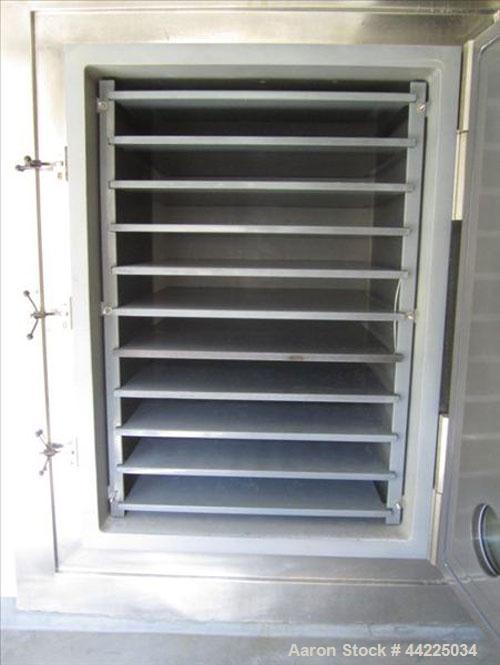 Used Stokes Vacuum Shelf Dryer, Model 900-338-205. Halar lined carbon steel. (10) 44" x 40" Shelves, 5.6" spacing, 95.2 cubic foot chamber, 122 sqaure foot shelf area. Chamber rated vacuum at 300 deg...