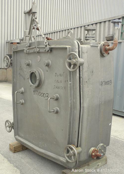 Used Von Roll Vacuum Shelf Dryer, approximately 183 square feet, carbon steel. (15) 48-3/4" wide x 35" deep jacketed coated shelves. 3" spacing between shelves. Internal chamber approximately 50" wid...