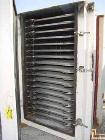 USED: Devine vacuum shelf dryer, approx 185 sq ft surface area, castaluminum. Unit has 17 heated shelves (16 usable) 42