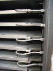 USED: Devine vacuum shelf dryer, approx 185 sq ft surface area, castaluminum. Unit has 17 heated shelves (16 usable) 42