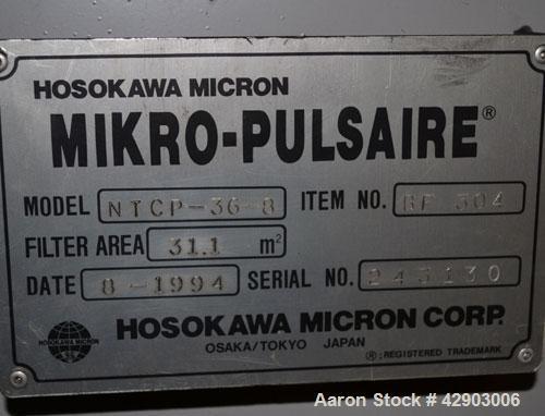 Used Hosokawa Micron Mikro-Pulsaire Pulse Jet Dust Collector, Model NTCP-36-8, 334 Square Filter Area. Carbon steel housing 60" diameter x 96" tall, 20" top plenum, coned bottom. Round type bags and ...