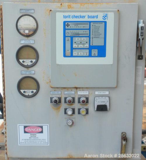 Used Torit Downflo II Cartridge Type Pulse Jet Dust Collector, model DFT3-18, carbon steel. 3420 square feet filter area, nominal airflow range 2,285-14,175 cfm. Includes a checkerboard  control pane...
