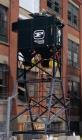Used Camfil Farr Dust Collector, Model GS6. up to 4,000 cfm. (4) Cartridges mounted in a symmetrical frame. Features: waste collection drum. Automatic cleaning control module. 15kw heavy duty fan, ve...