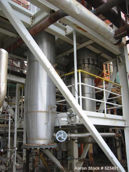 USED: Rossi Catelli double effect evaporator, model T60, rated 48,400 lbs/hour water evaporation, feed rate of 60,000 lbs/hour, finished product rate of 12,000 lbs/hour, 316 stainless steel. Used to ...