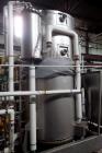 Used MECO Vapor Compression Still, Model PES1000MSSH. Nominally rated 1000 gph. 75 hp blower. Skid mounted. Serial# 7702, built 2001.