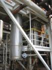 USED: Rossi Catelli double effect evaporator, model T60, rated 48,400 lbs/hour water evaporation, feed rate of 60,000 lbs/hour, finished product rate of 12,000 lbs/hour, 316 stainless steel. Used to ...
