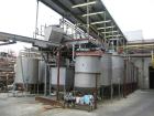 USED: Rossi Catelli double effect evaporator, model T60, rated 48,400 lbs/hour water evaporation, feed rate of 60,000 lbs/hour, finished product rate of 12,000 lbs/hour, 316 stainless steel. Used to ...